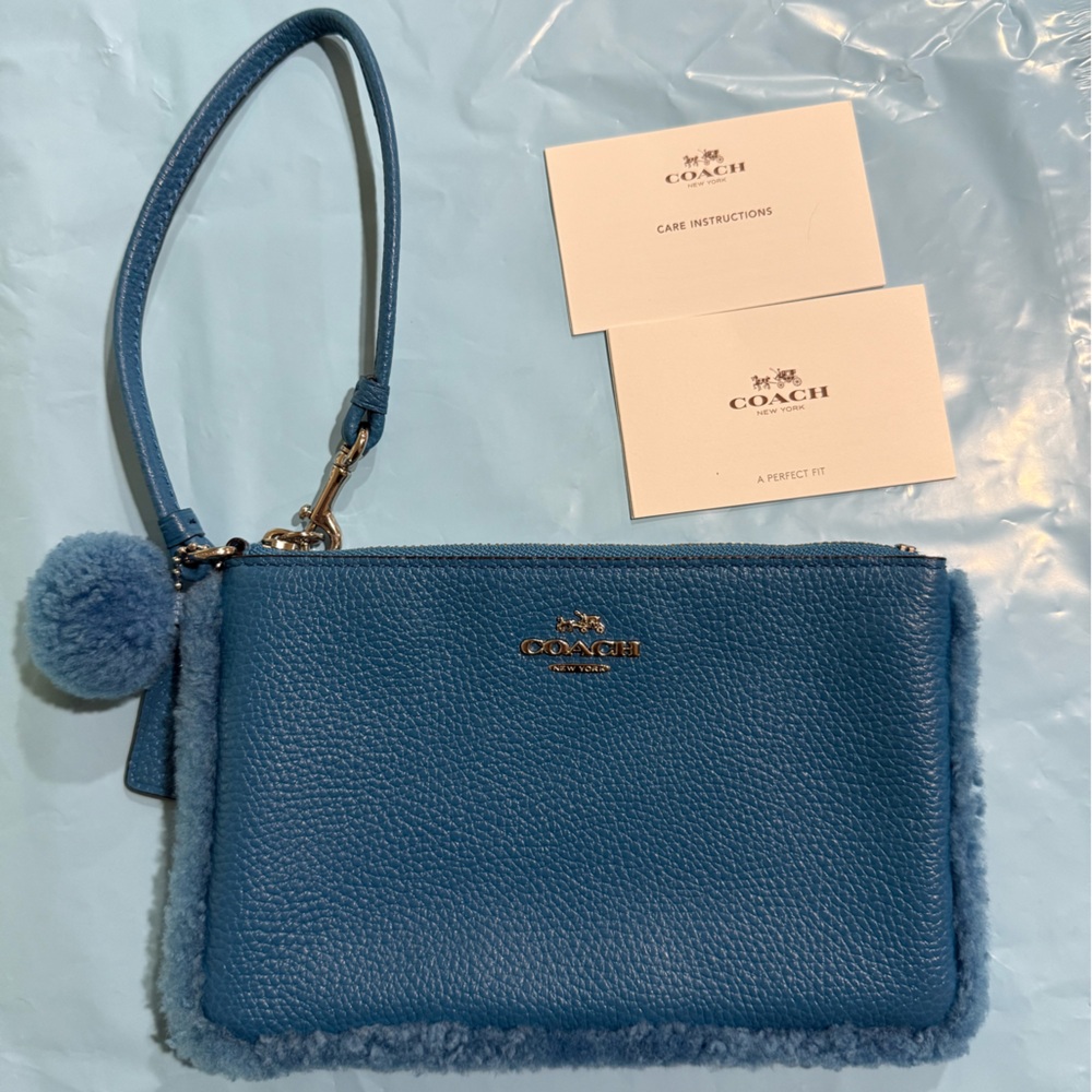Coach peacock Blue Shearling faux fur Trim Pom Pom Wristlet 7” x 4” pouch GREAT